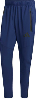 Tepláky adidas TIRO TRAVEL WOVEN PANT modrá